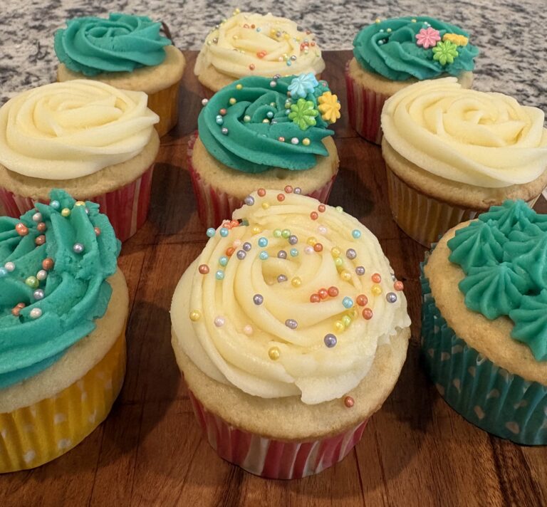 green and white cupcakes closeup 768x712